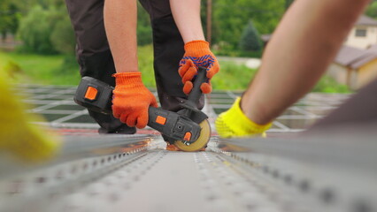 Slow motion of construction worker cutting steel beam. Man works circular saw. Flies of spark from hot metal. Man worked over the steel. close-up of hand and electric saws metal. Close-up of hand too.