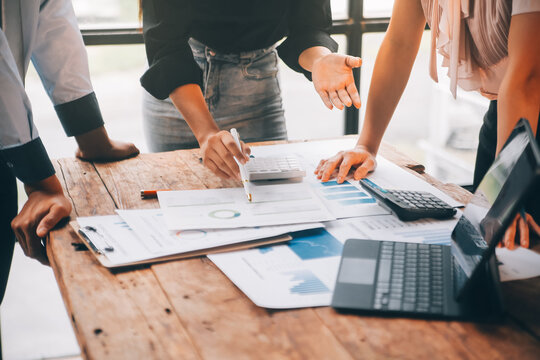 Fund managers team consultation and discuss about analysis Investment stock market at office