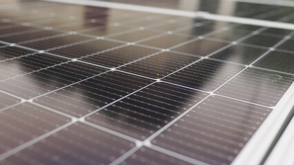 Close up of connecting electric cable to solar panels at solar power plant. Connection and installation of solar panels. Solar panel on the background.