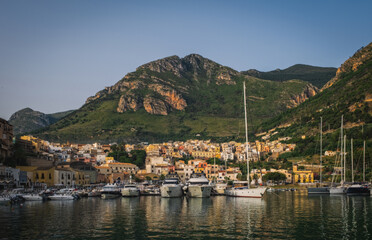 Castellammare del Golfo, Italy - June 2023: Fishing port with old wooden fishing boats docked at the marina in Castellammare del Golfo, Sicily, Italy