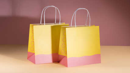 Mockup of a two-color paper bag with paper handles