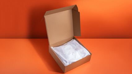 Mockup of a large corrugated cardboard box with tissue paper inside