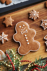 Homemade gingerbread Christmas man decorated with white icing