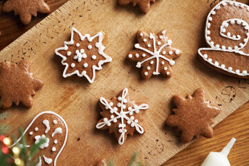 Star shaped homemade gingerbread Christmas cookies decorated with white icing
