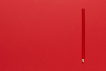 Minimalist Red Pencil on Red Background: Creative Simplicity Art