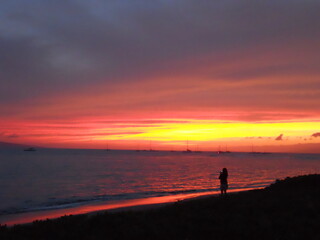 Orange, pink, purple and blue sunset on the beach in Maui Hawaii