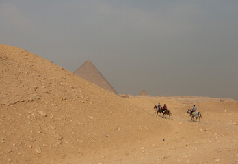 Arab riders near the pyramids