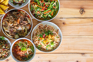 The Khao Soi Yuan Naan that is served on the plate is Khao Soi noodles mixed with minced pork spring onion coriander and chili lime and sesame spicy and sour. noodles chinese food tai yai food