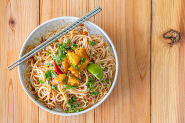 The Khao Soi Yuan Naan that is served on the plate is Khao Soi noodles mixed with minced pork spring onion coriander and chili lime and sesame spicy and sour. noodles chinese food tai yai food