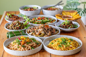 The Khao Soi Yuan Naan that is served on the plate is Khao Soi noodles mixed with minced pork spring onion coriander and chili lime and sesame spicy and sour. noodles chinese food tai yai food