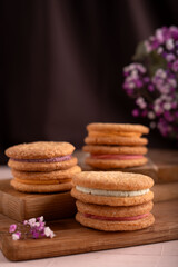 photo Delicious and Colorful Homemade Cream-Filled Sandwich Cookies Perfect for Tea Parties, Dessert Tables, and Holiday Celebrations with Family and Friends