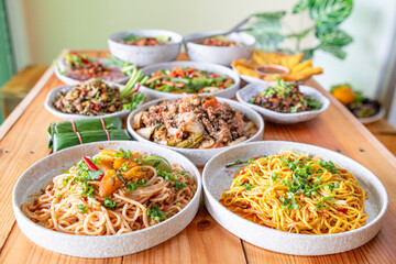 The Khao Soi Yuan Naan that is served on the plate is Khao Soi noodles mixed with minced pork spring onion coriander and chili lime and sesame spicy and sour. noodles chinese food tai yai food