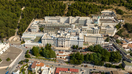 Obraz premium Aerial view of the Home for the Relief of Suffering (Ospedale Casa Sollievo della Sofferenza) hospital located in San Giovanni Rotondo, in the province of Foggia, in Puglia, Italy.