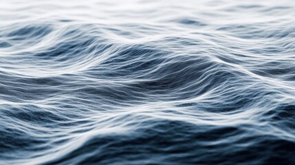 An abstract depiction of ocean waves, showcasing intricate patterns and textures in shades of blue and white. It evokes a sense of calmness and fluidity.