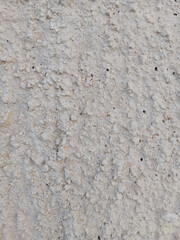 Close-up of natural stone texture with different shades of grey, brown and white. Natural cracks and patterns create a striking and unique texture.