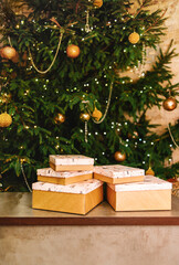 A beautifully decorated and festive Christmas Tree adorned with an array of gift boxes