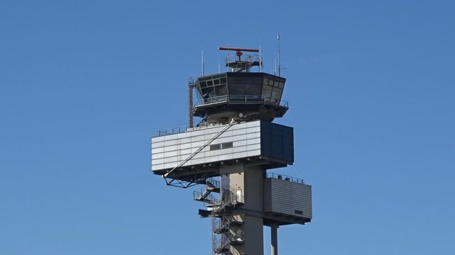 airport control tower equipped radar system importance atc managing flights intricate operations rotating static shot aviation air traffic management observation safety navigation 