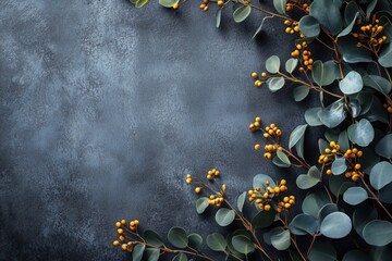 Eucalyptus branches with yellow berries create a beautiful frame on a dark textured background, offering a stylish and natural aesthetic for various design purposes