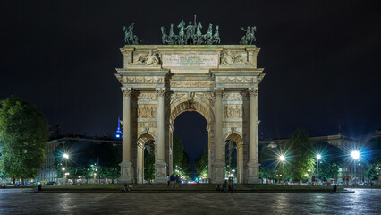 Fototapeta premium Arch of Peace in Simplon Square timelapse hyperlapse at night. It is a neoclassical triumph arch