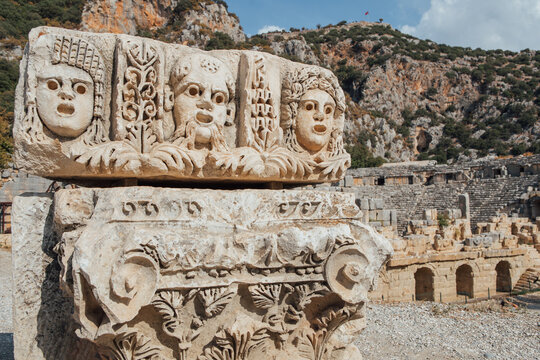 Historical stone bas-relief with carved faces in ancient city of Myra, Demre, Antalya Province, Lycia,Turkey.Historic necropolis reveals craftsmanship of ancient civilizations.