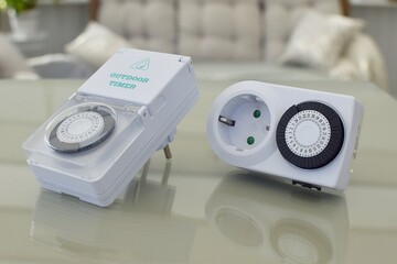 Mechanical timers for indoor and outdoor sockets at home. Smart home tools