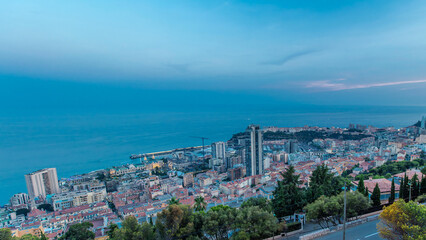 Cityscape of Monte Carlo, Monaco day to night timelapse with roofs of buildings after summer sunset.