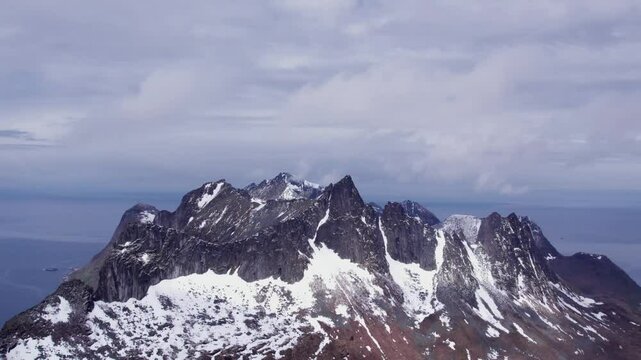 snow covered mountains in winter in norway on senja