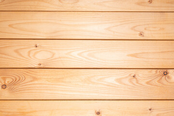 Wooden yellow background. Texture of pine boards. Pine boards coated with a colourless impregnation for preservation.