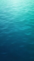 Obraz premium A tranquil expanse of water, showcasing subtle ripples and a gradient of blues.