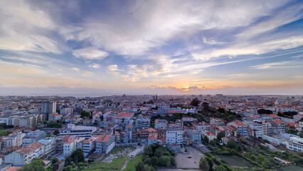 Obraz premium Rooftops of Porto's old town on a warm spring day timelapse during sunset, Porto, Portugal