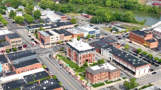 Aerial Arc of Defiance County Courthouse Surrounded by Downtown Charm