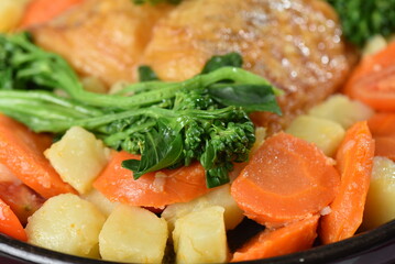 codfish typical Portuguese dish baked cod with onion garlic peppers and potatoes rustic Portuguese food salted fish cooked olive oil