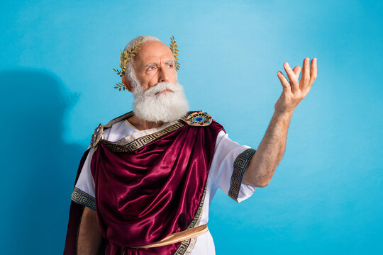 Photo of attractive old man politician speech recipe poem dressed greek god emperor actor costume isolated on blue color background
