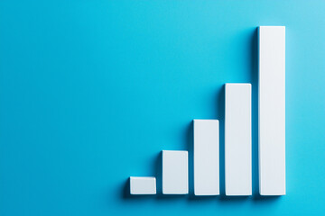 White rising bar chart on blue background with copy space. Business economic and money investment concept. Goal and success theme