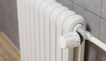 radiator on the wall, close up white heater valve. 3d rendering