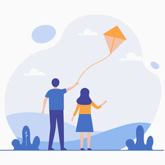 A man and a woman are flying a kite in a field. The man is holding the kite string while the woman looks on. The scene is peaceful and relaxing