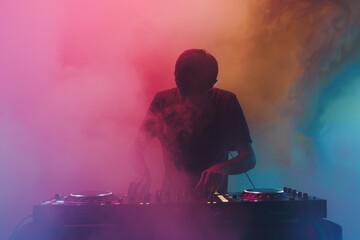 DJ playing music at mixer on colorful foggy background