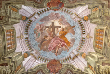 ALESSANDRIA, ITALY - SEPTEMBER 9, 2024: The ceiling baroque fresco of angels with the cross in the church Chiesa di San Giovannino by unknown artist. 