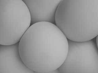 Gray balloons of a round geometric shape