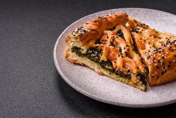 Pieces of quiche with salmon, spinach or broccoli, salt and spices