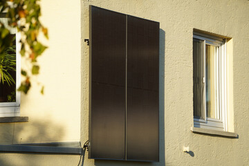 A balcony power plant mounted on the facade of a residential building