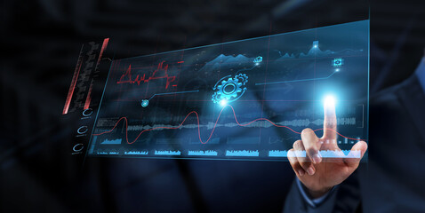 Automation: Businessman analyzes data strategy with graph on digital screen. Efficiency, process...
