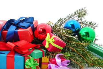 Christmas tree branch with gifts and decorations.