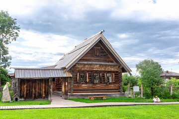 Suzdal, Vladimir region, Russia, Golden Ring - A view of the street of an ancient provincial Russian city on a summer evening. An ancient building, an architectural monument, an apartment building.
