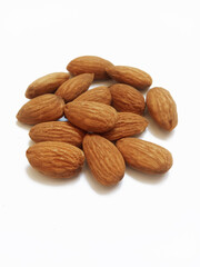 a pile of almonds on white background