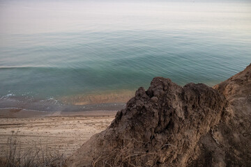 Aerial View of a Serene Blue Ocean and Sandy Beach

