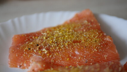 Spiced pieces of salmon on a plate
