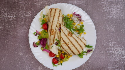 Tortilla wrap with vegetables and garlic sauce