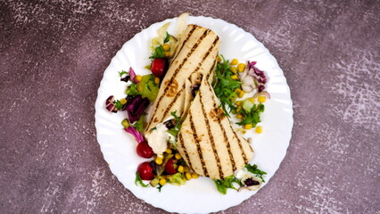 Tortilla wrap with vegetables and garlic sauce