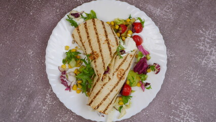 Tortilla wrap with vegetables and garlic sauce